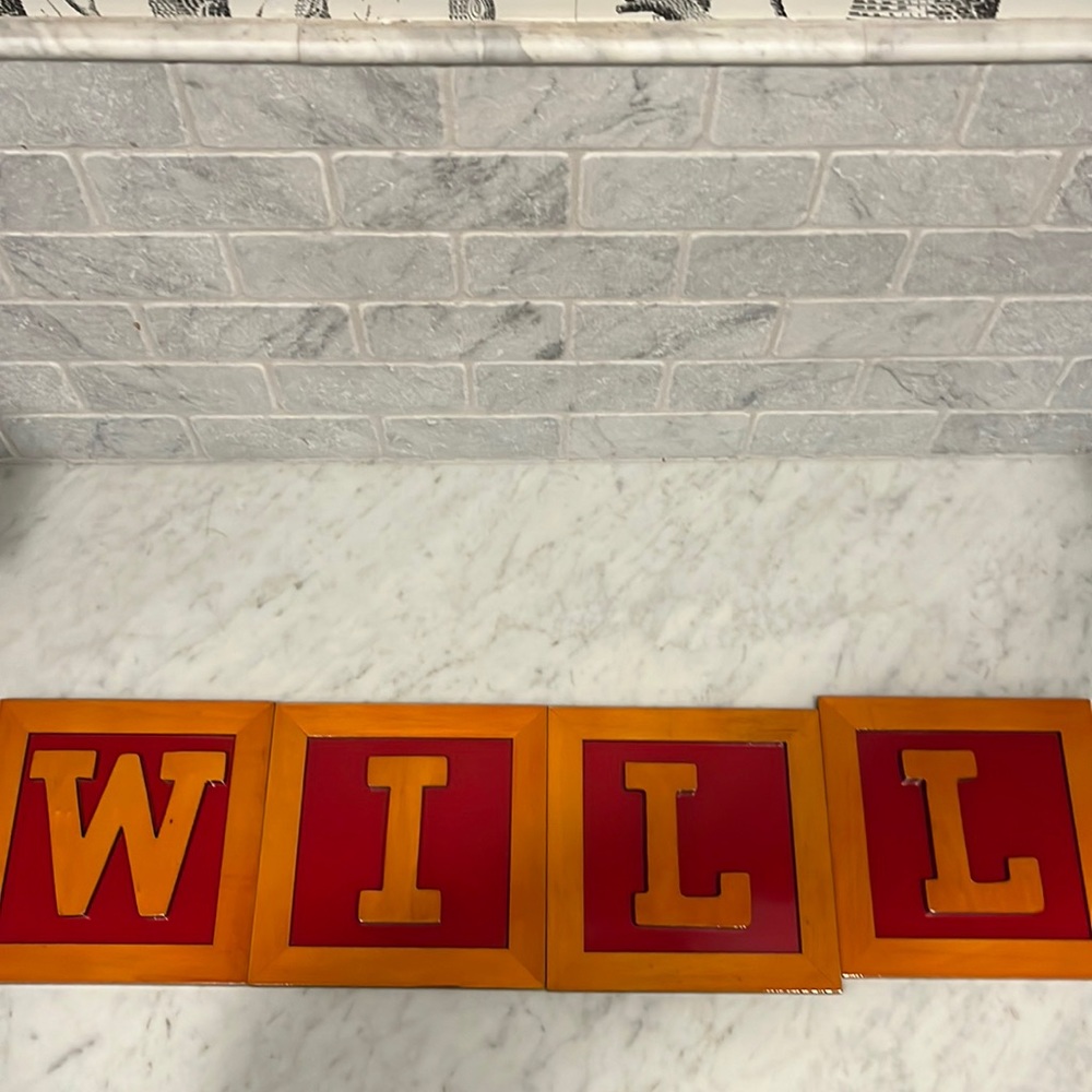 “WILL” letters for bedroom decoration. Wood with red painted background.